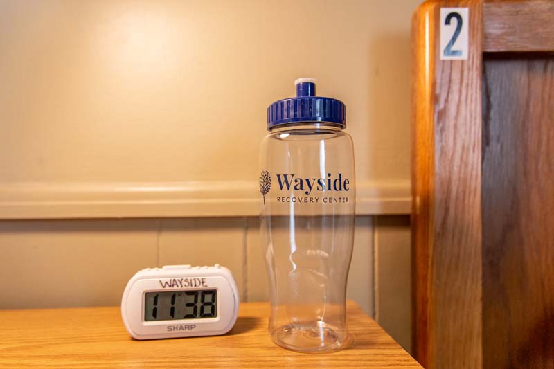 Wayside water bottle and alarm clock