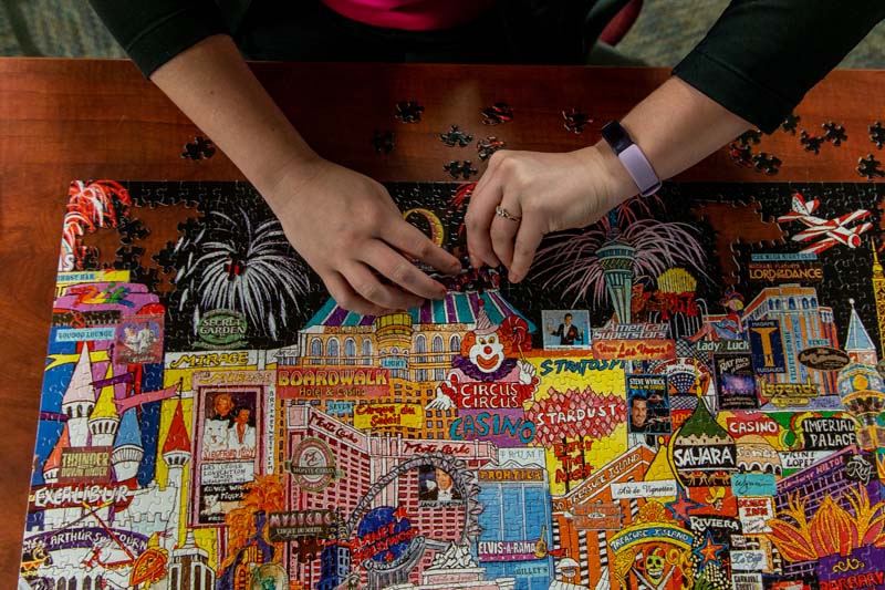 A client works on a puzzle in her downtime